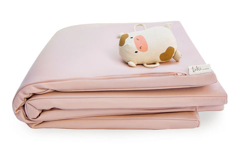 folded toki mats play mat in petal with toy on top